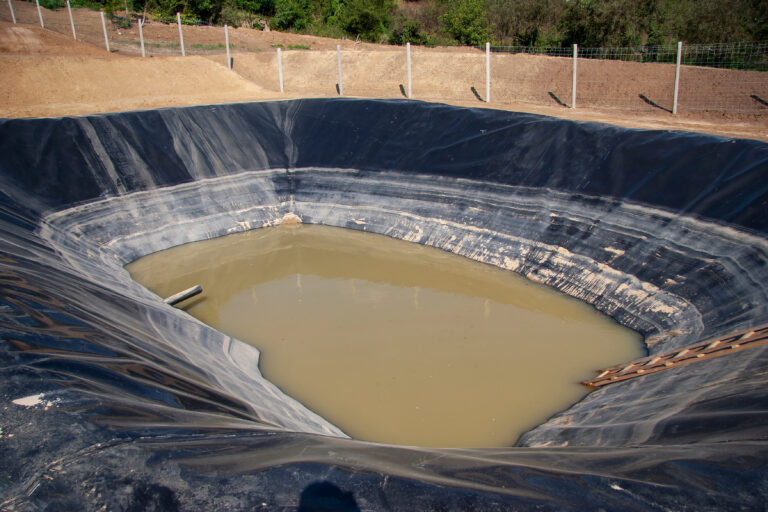 insulated leachate pond with dirty water, part of landfill