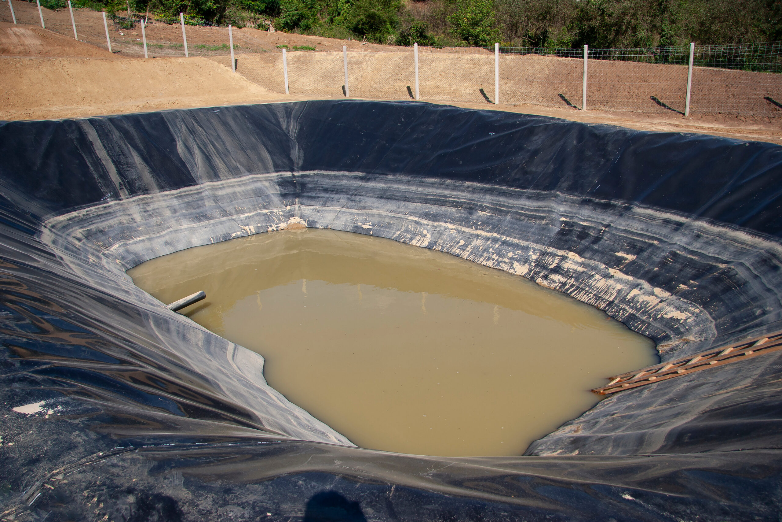 insulated leachate pond with dirty water, part of landfill